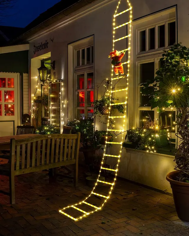 Łańcuch świetlny LED Święty Mikołaj na drabinie 3 m ciepła biel 338 LED